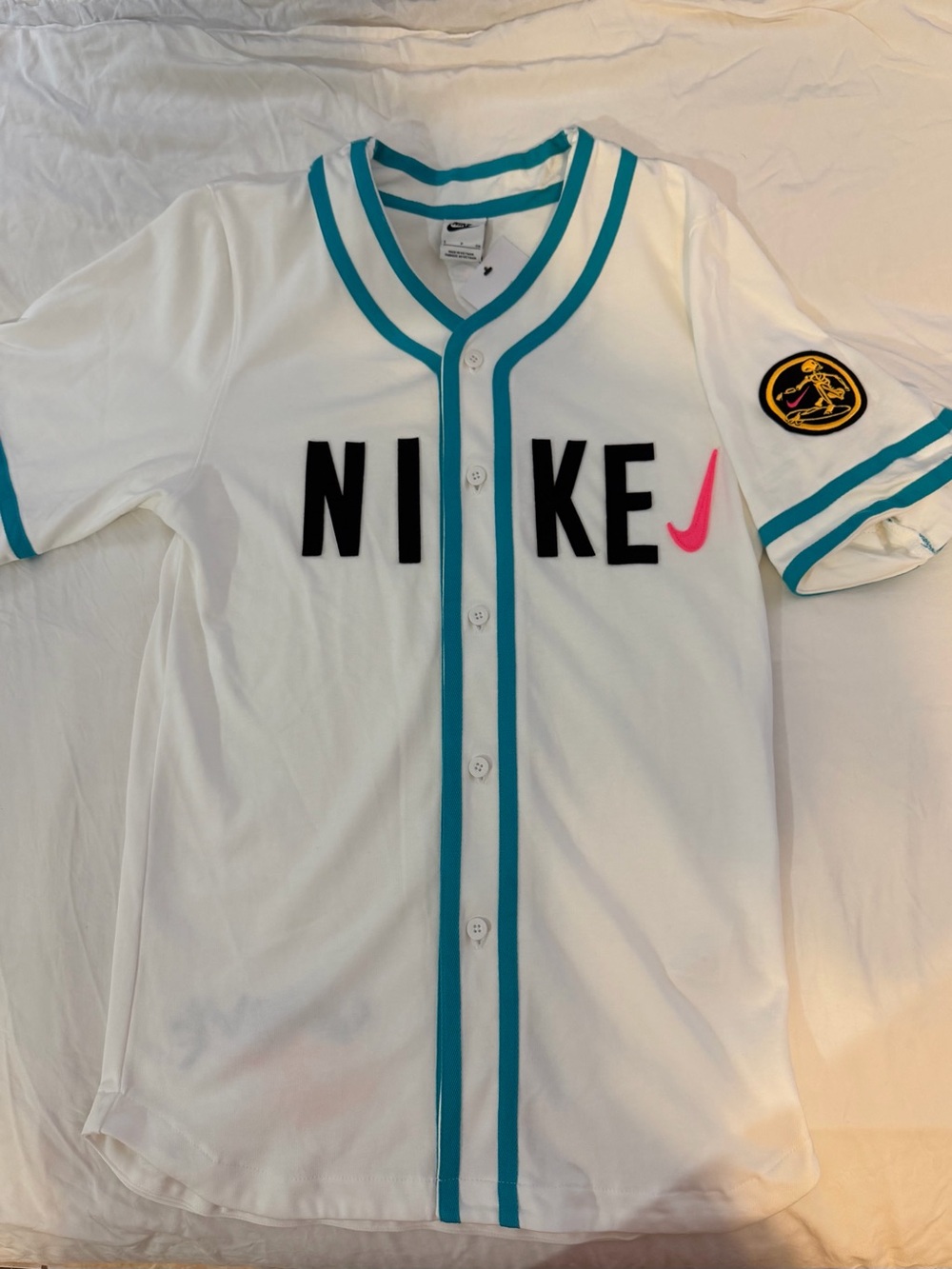 Nike White Baseball-Style Jersey with Teal Trim and Pink Swoosh